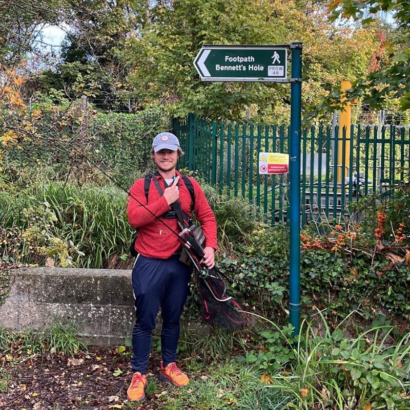Me standing by the River Wandle with travel fishing gear in tow