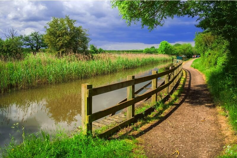 A canal running through the British countryside 
