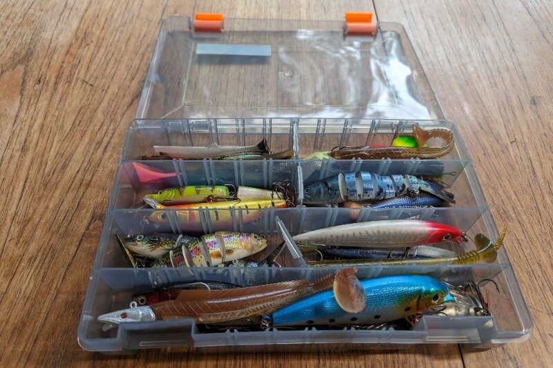 A larger Savage Gear lure box containing a wide variety of lures
