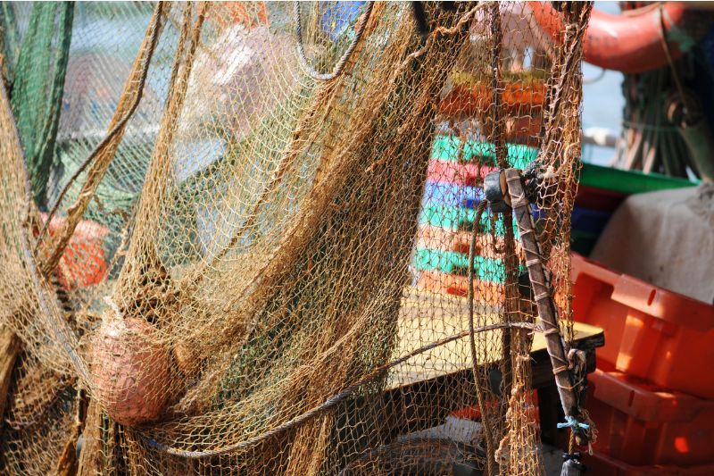 Fishing nets hanging from a commercial trawler