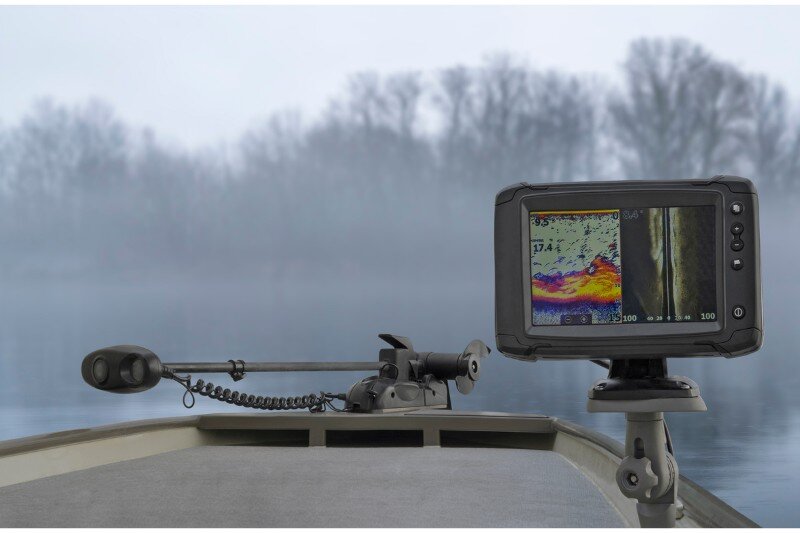 A fish finder on board a board on an overcast lake