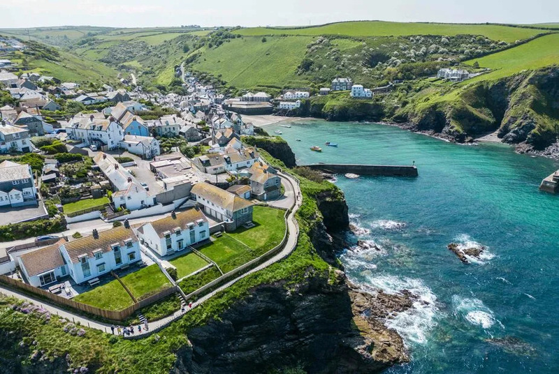 An aerial view of Gulland cottage, the sea and the bay at Port Isaac