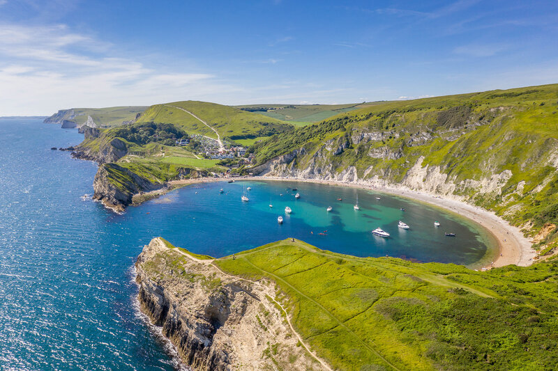 A sunny view over Lulworth Cove