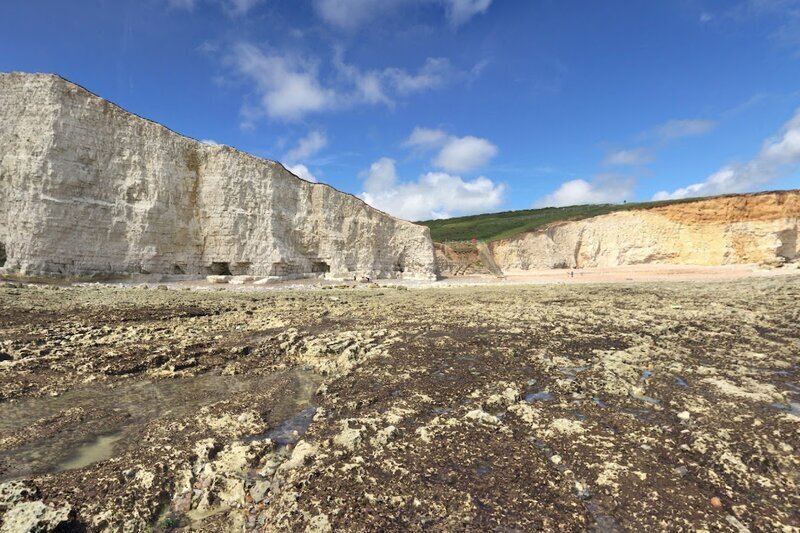 Photograph of the shingle beach and white cliffs down at Cuckmere Haven taken from Google Maps Street View