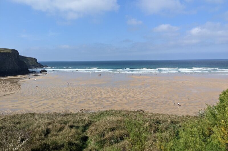 A view over the beach at Mawgan Porth on a sunny day when the tide's out